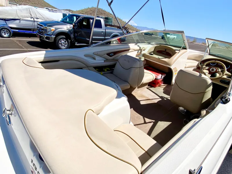 Slide: The Image of Interior of a 2001 Sea Ray 185 Bow Rider boat, beige upholstery. - 16