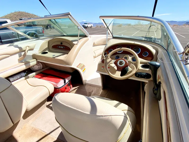 Slide: The Image of Interior of a 2001 Sea Ray 185 Bow Rider boat, beige upholstery. - 17