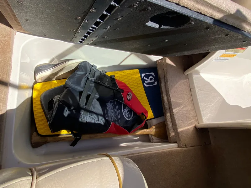 Slide: The Image of Storage compartment in 2001 Sea Ray 185 Bow Rider boat. - 18