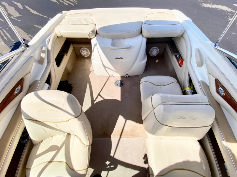 Slide: The Image of Interior of a 2001 Sea Ray 185 Bow Rider boat, beige upholstery. - 21