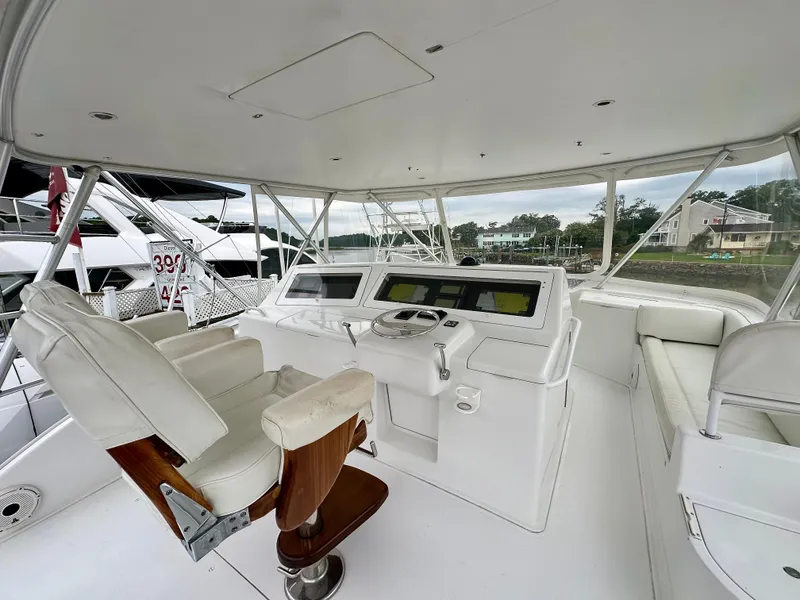 Slide: The Image of 2004 Viking 56 Convertible SONAR yacht helm with captain's chair and navigation equipment. - 10