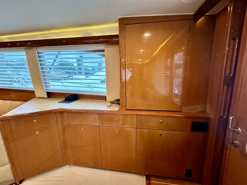Slide: The Image of Luxurious interior of 2004 Viking 56 Convertible SONAR yacht with wooden cabinetry. - 14