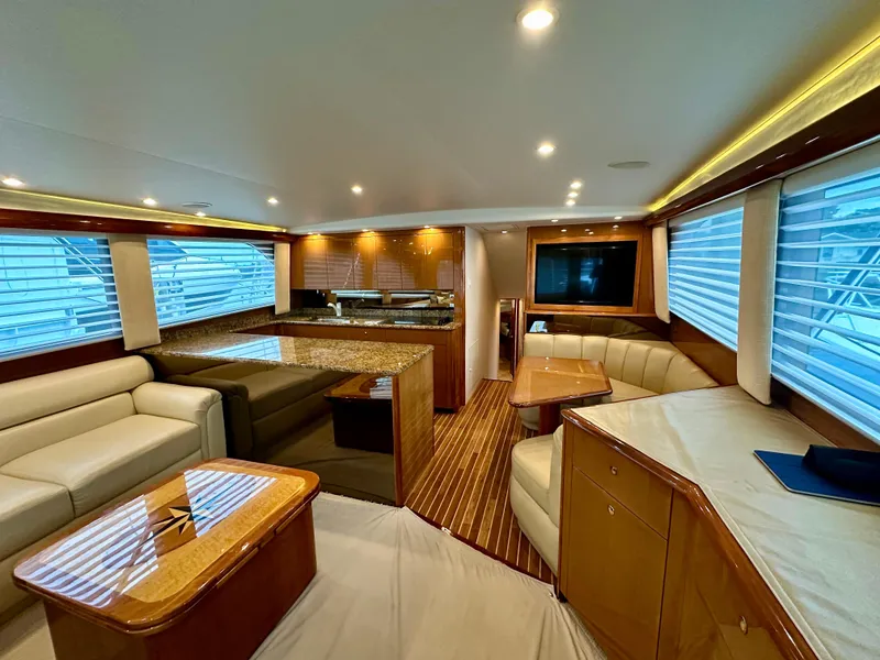 Slide: The Image of Luxurious interior of 2004 Viking 56 Convertible SONAR yacht with elegant seating and wood finishes. - 17