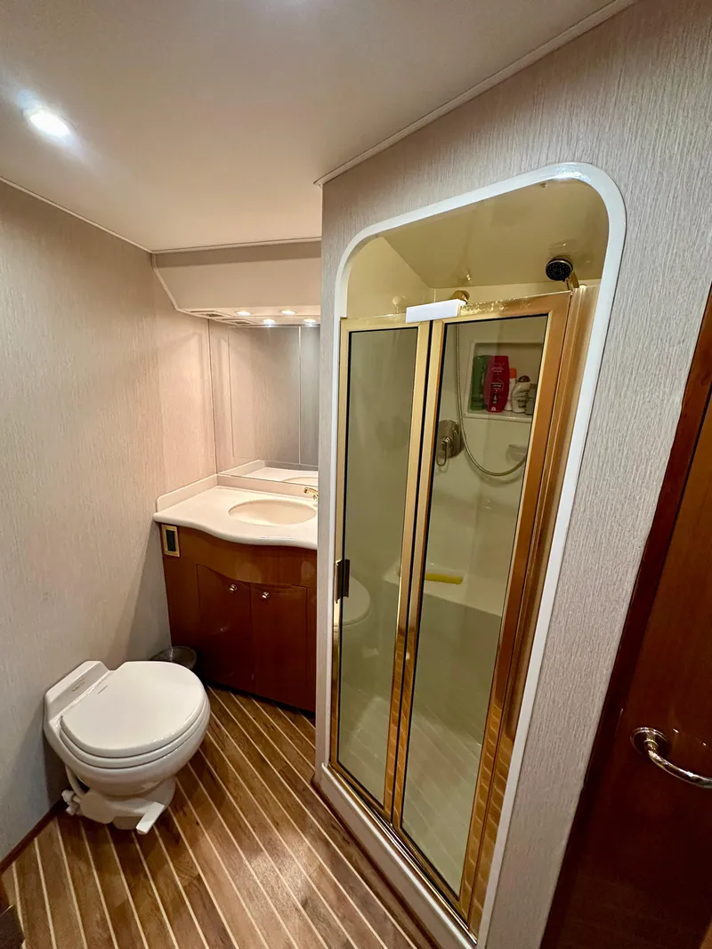Slide: The Image of Luxurious bathroom in 2004 Viking 56 Convertible SONAR yacht with shower and wooden flooring. - 19