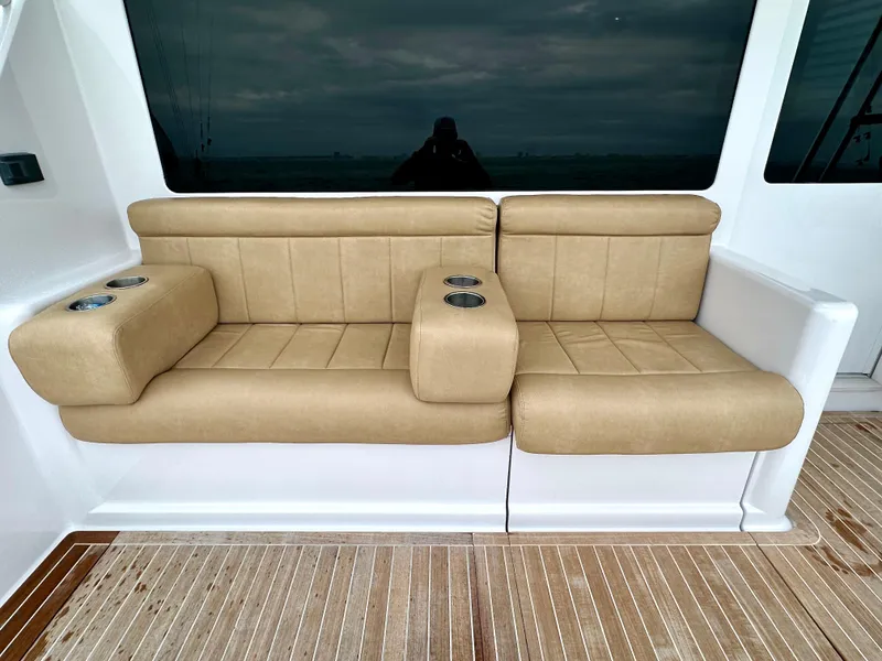 Slide: The Image of Beige seating on 2004 Viking 56 Convertible SONAR yacht deck with cup holders. - 25