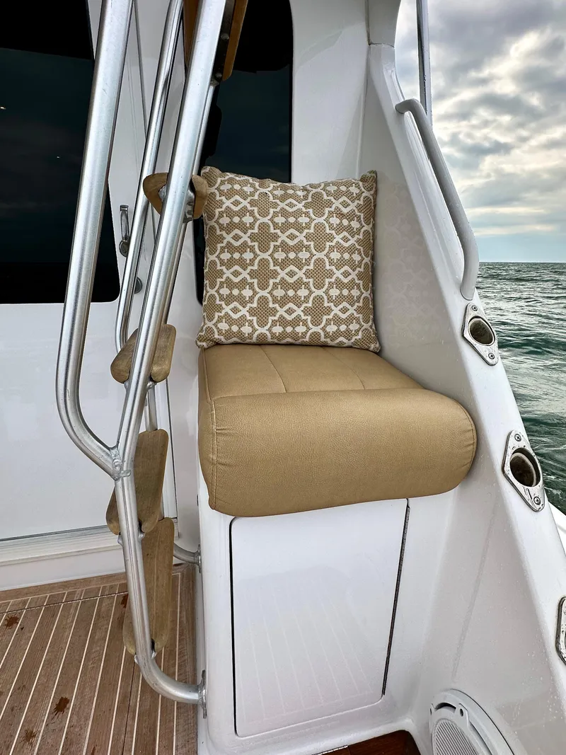 Slide: The Image of Viking 56 Convertible SONAR 2004 boat seating with cushion, ocean view. - 26