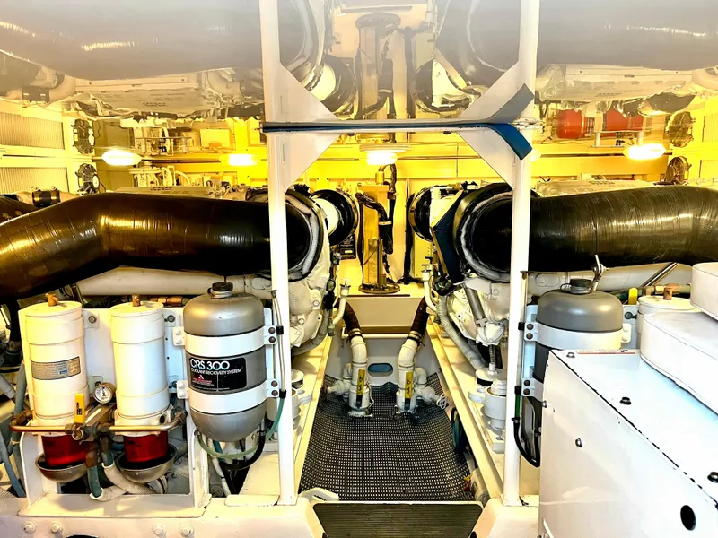 Slide: The Image of Engine room of 2004 Viking 56 Convertible SONAR yacht, showcasing machinery and equipment. - 27