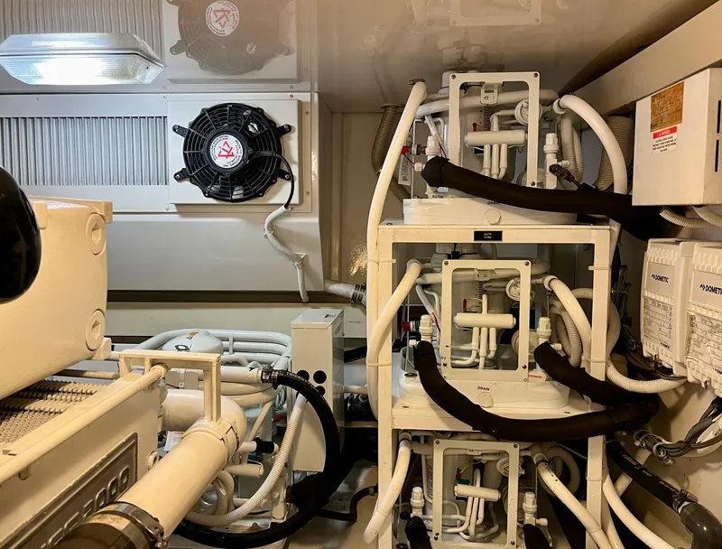 Slide: The Image of Engine room of 2004 Viking 56 Convertible SONAR with complex piping and machinery. - 30