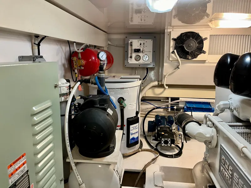 Slide: The Image of Engine room of 2004 Viking 56 Convertible SONAR with equipment and controls. - 32