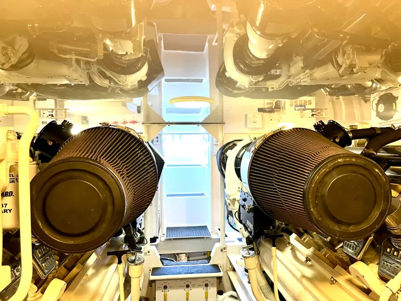 Slide: The Image of Engine room of 2004 Viking 56 Convertible SONAR yacht, showcasing dual air filters. - 33