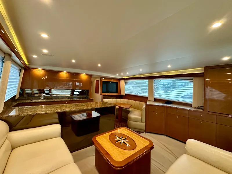 Slide: The Image of Luxurious interior of 2004 Viking 56 Convertible SONAR yacht with elegant seating and modern amenities. - 4