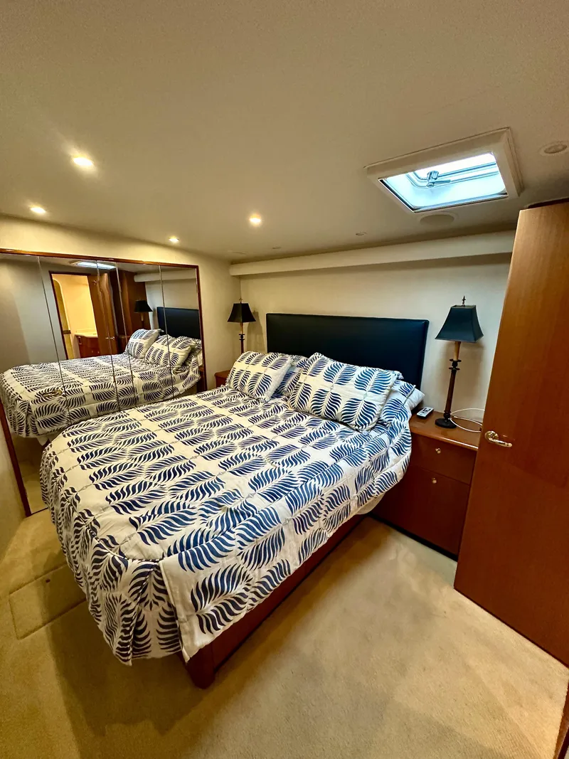 Slide: The Image of Luxurious bedroom in 2004 Viking 56 Convertible SONAR yacht with elegant bedding. - 5