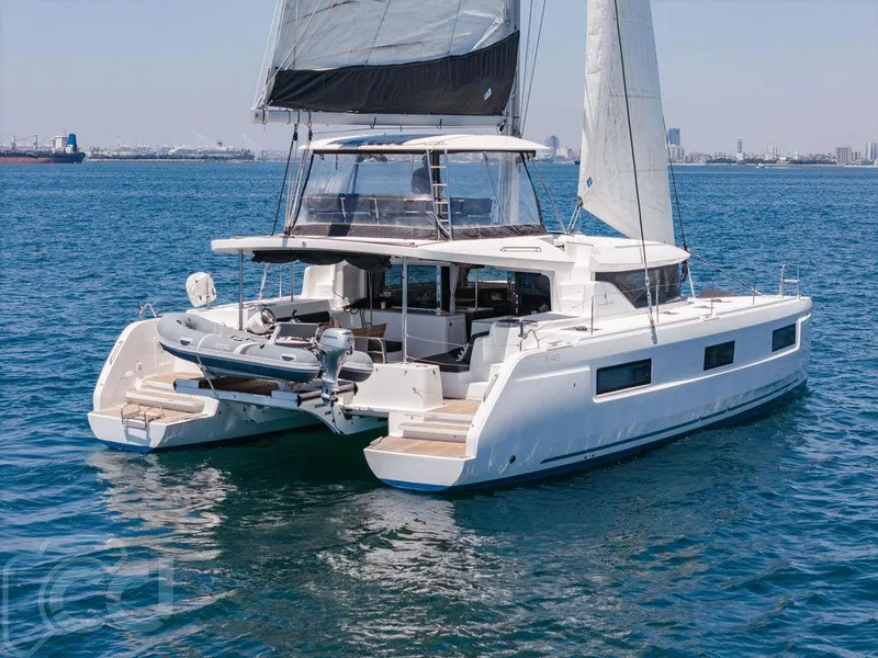 Slide: The Image of 2021 Lagoon 46 catamaran sailing on calm blue waters. - 2