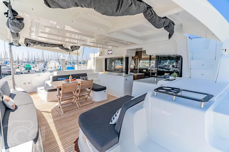 Slide: The Image of Luxurious Lagoon 46 catamaran interior, 2021 model, featuring spacious seating and modern amenities. - 24