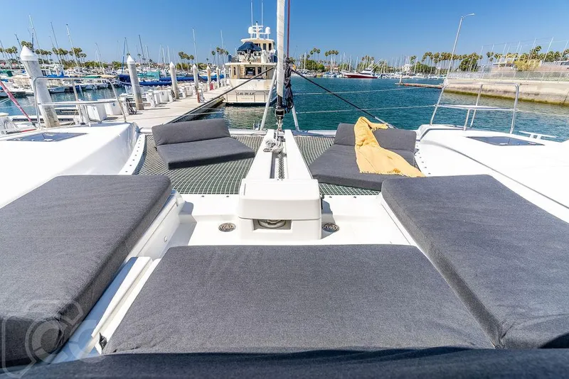 Slide: The Image of Luxurious Lagoon 46 catamaran, 2021 model, docked at a sunny marina. - 26