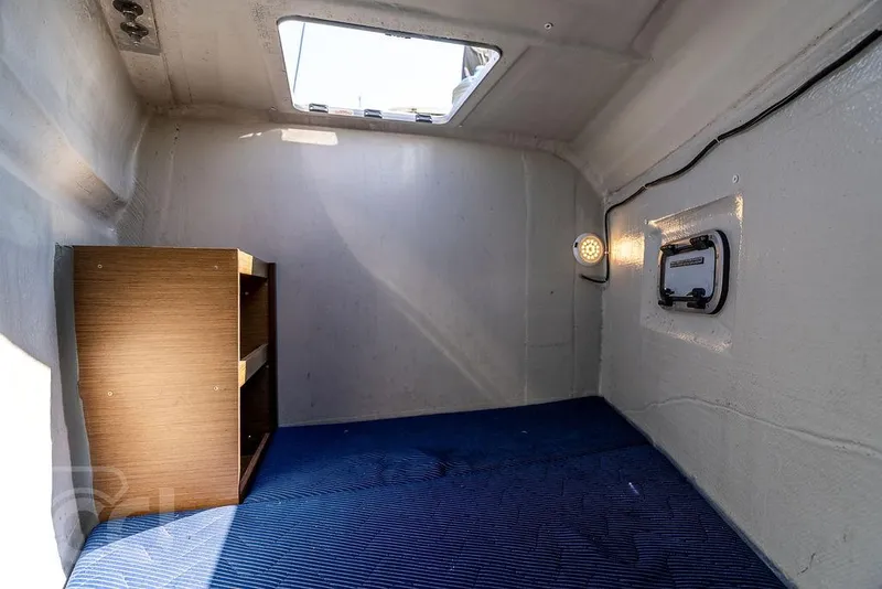 Slide: The Image of Interior cabin of 2021 Lagoon 46 yacht with skylight and shelving. - 32