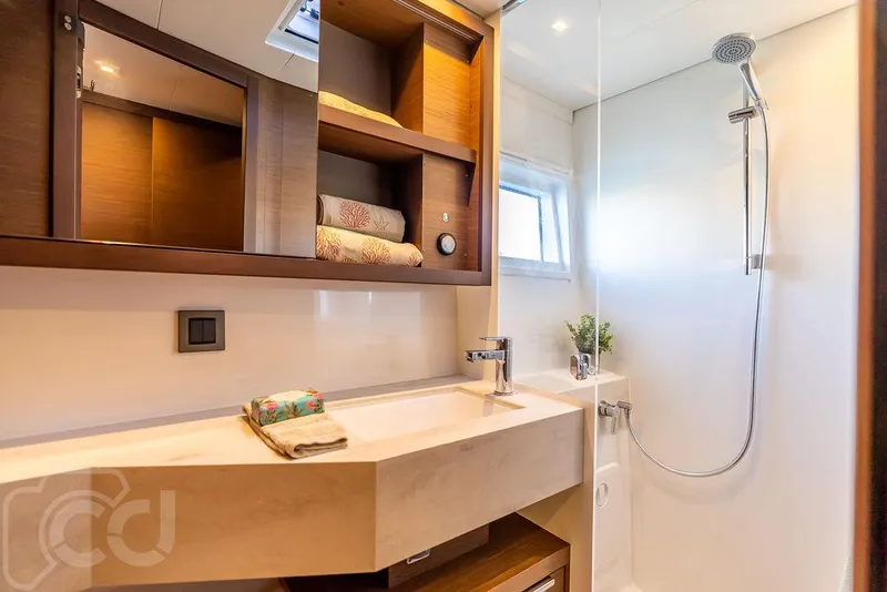 Slide: The Image of Modern bathroom in 2021 Lagoon 46 yacht with shower and wooden shelving. - 36