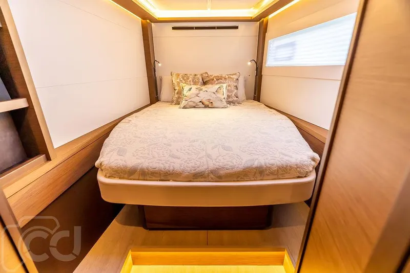 Slide: The Image of Luxurious cabin interior of 2021 Lagoon 46 yacht with cozy bed and ambient lighting. - 38