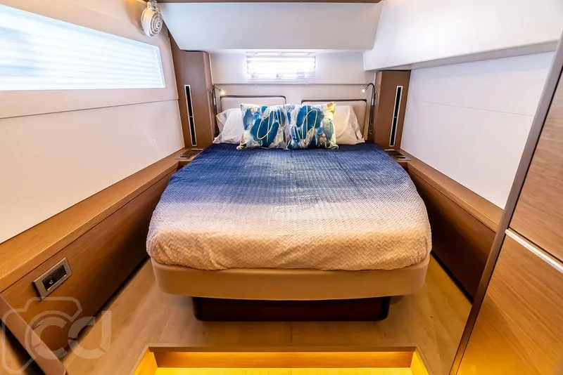 Slide: The Image of Luxurious bedroom interior of 2021 Lagoon 46 yacht with modern design and cozy bedding. - 41