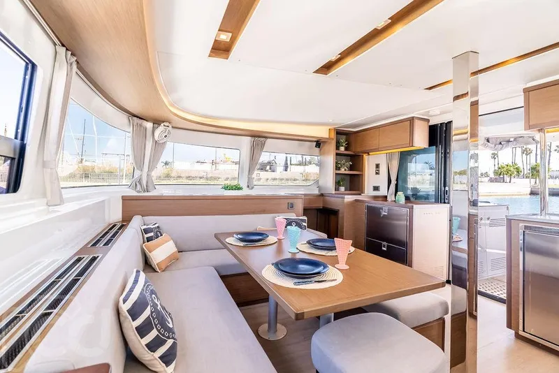 Slide: The Image of Luxurious interior of 2021 Lagoon 46 catamaran with elegant dining area and modern kitchen. - 47