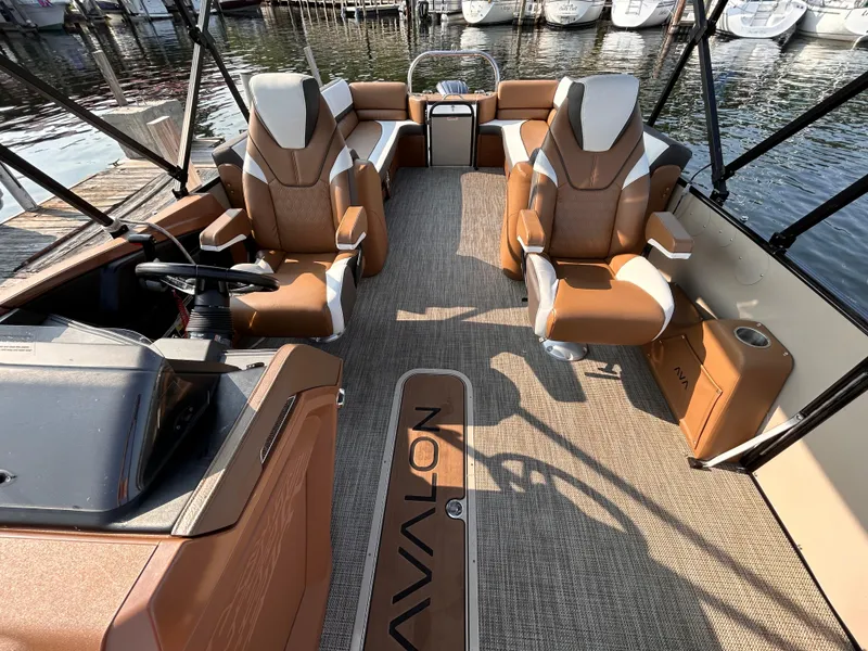 Slide: The Image of 2024 Avalon Catalina Quad Lounge 25' interior with luxurious seating and modern design. - 21