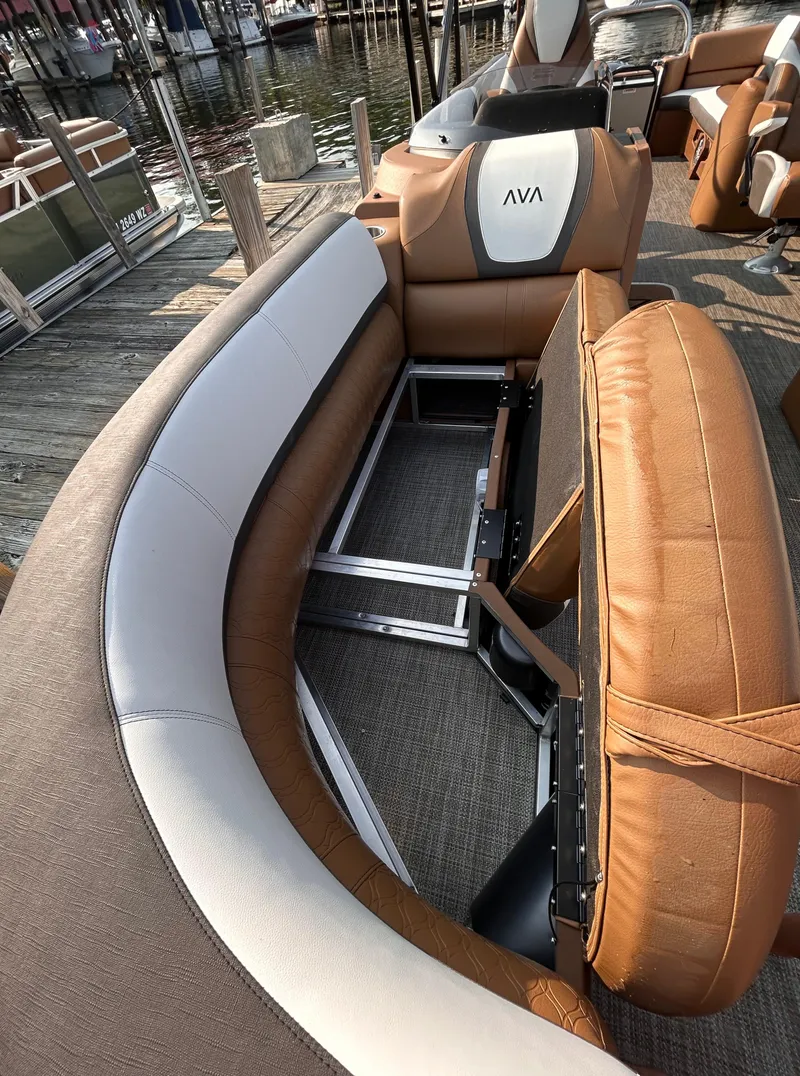 Slide: The Image of 2024 Avalon Catalina Quad Lounge 25' interior with tan and white seating. - 34