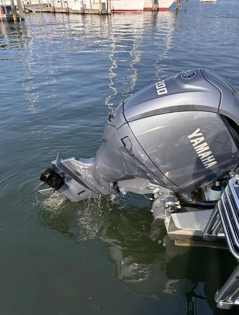 Slide: The Image of 2024 Avalon Catalina Quad Lounge with Yamaha outboard motor on water. - 35