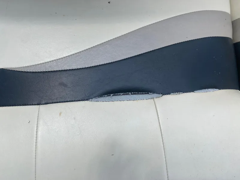 Slide: The Image of Close-up of 2007 Aloha Pontoon PS 220 TT seat with blue and gray upholstery. - 15