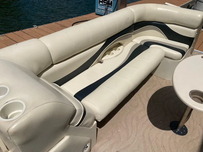 Slide: The Image of 2007 Aloha Pontoon PS 220 TT with beige seating and cup holders. - 3