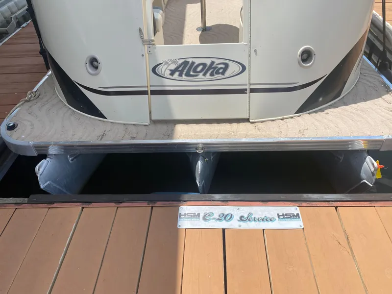 Slide: The Image of 2007 Aloha Pontoon PS 220 TT docked, rear view with logo and deck details. - 4