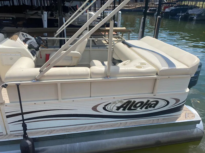 Slide: The Image of 2007 Aloha Pontoon PS 220 TT boat with beige seating, docked on a sunny day. - 5