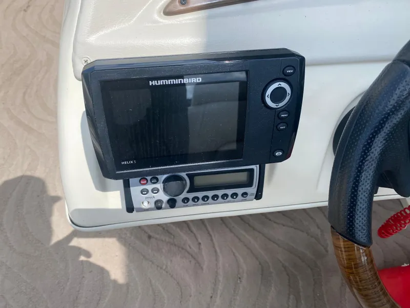 Slide: The Image of Humminbird fish finder and radio on 2007 Aloha Pontoon PS 220 TT dashboard. - 6