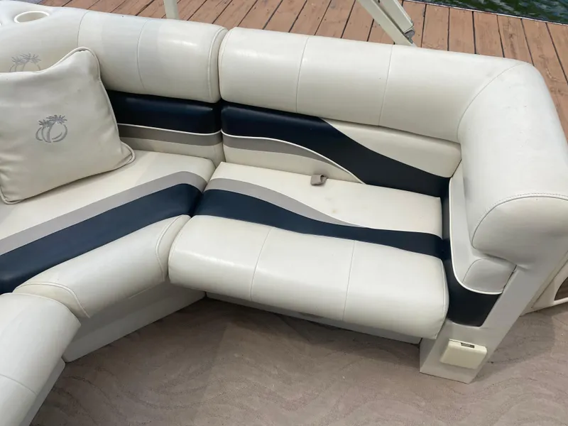 Slide: The Image of 2007 Aloha Pontoon PS 220 TT boat seating with white and navy upholstery. - 7
