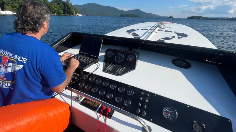 Slide: The Image of Man operating 1979 Scarab Larry Smith 38 speedboat on a scenic lake. - 10