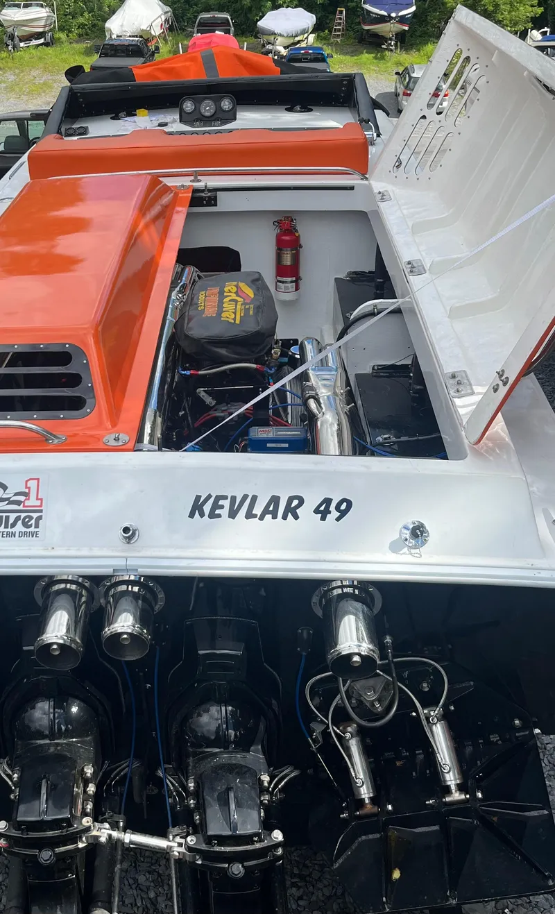 Slide: The Image of 1979 Scarab Larry Smith 38 boat with Kevlar 49 engine, open hatch, and fire extinguisher. - 12