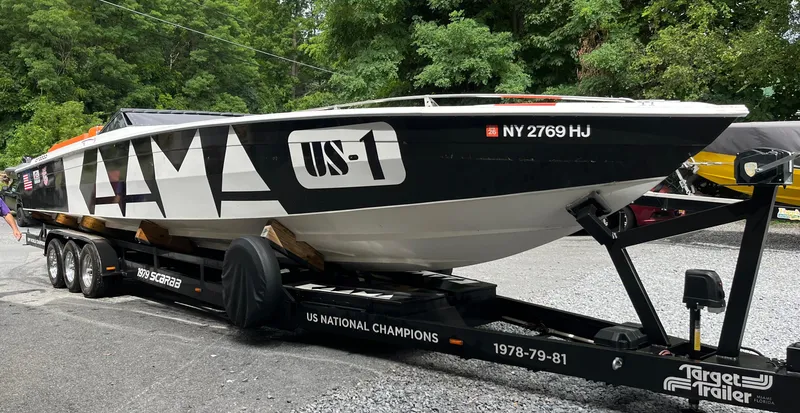 Slide: The Image of 1979 Scarab Larry Smith 38 speedboat on trailer, US National Champions 1978-81. - 15
