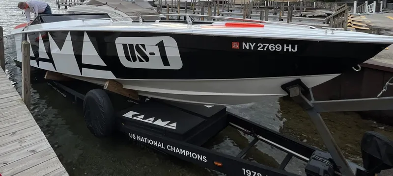 Slide: The Image of 1979 Scarab Larry Smith 38 speedboat on trailer, US National Champions branding. - 8