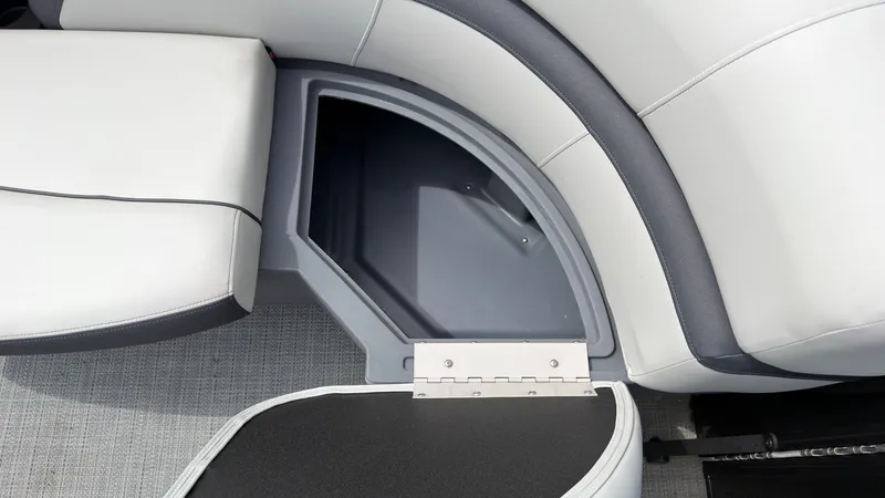 Slide: The Image of The image shows a storage compartment on a boat with cushioned seating and gray flooring. - 14
