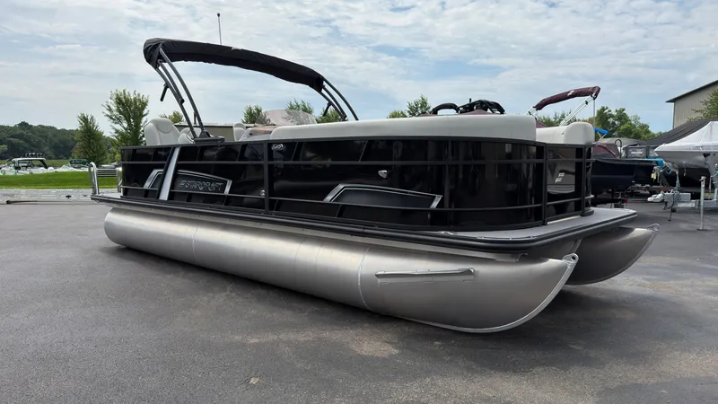 Slide: The Image of Starcraft EXS 3 FD TT 2025: Sleek pontoon boat with black railing and silver hull. - 1