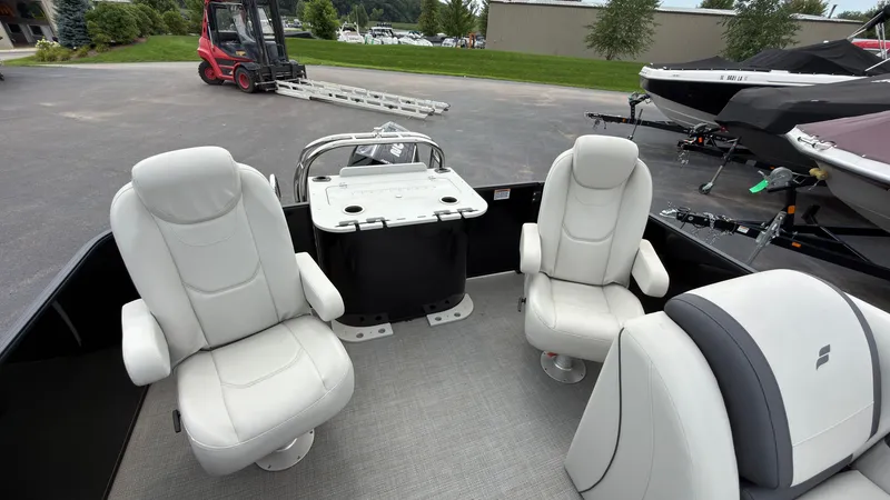Slide: The Image of The image shows the interior of a 2025 Starcraft EXS 3 FD TT with white leather seats. - 49