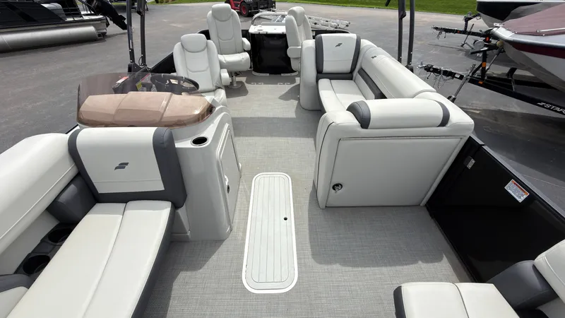 Slide: The Image of Starcraft EXS 3 FD TT 2025: Spacious deck with sleek, light gray upholstery and modern design. - 22