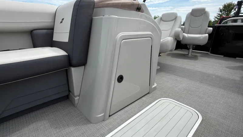 Slide: The Image of The image shows the interior of a 2025 Starcraft EXS 3 FD TT boat with sleek seating and modern design. - 27