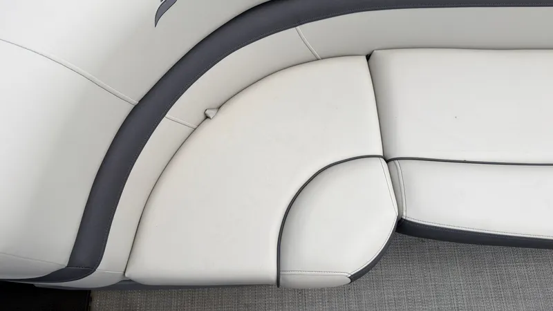 Slide: The Image of 2025 Starcraft EXS 3 FD TT featuring sleek, cushioned seating in white and gray. - 18