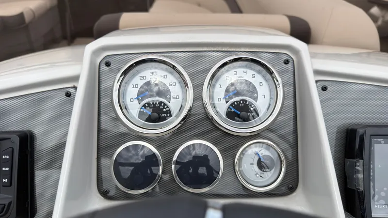 Slide: The Image of Dashboard of a 2025 Starcraft EXS 3 FD TT with speedometers and gauges. - 42