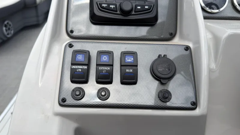Slide: The Image of Control panel of a Starcraft EXS 3 FD TT boat with various switches and sockets. - 40