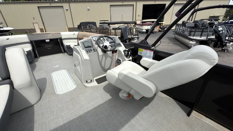 Slide: The Image of The image shows the cockpit of a 2025 Starcraft EXS 3 FD TT with a comfortable captain's chair. - 37