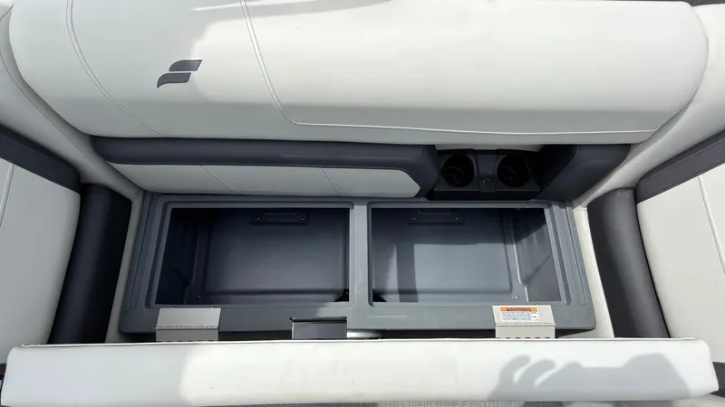 Slide: The Image of Storage compartment under a cushioned seat on a boat. - 33