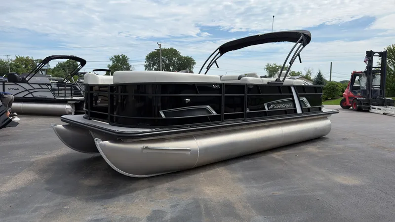 Slide: The Image of 2025 Starcraft EXS 3 FD TT pontoon boat with black railing and silver pontoons. - 7