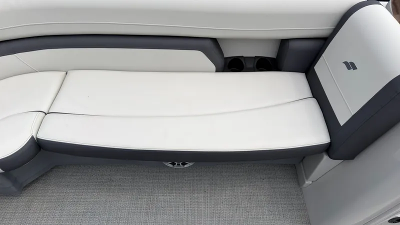 Slide: The Image of Seating area on a 2025 Starcraft EXS 3 FD TT boat with gray and white upholstery. - 20