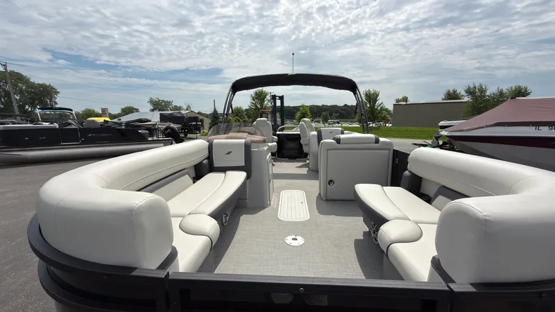 Slide: The Image of The image shows a 2025 Starcraft EXS 3 FD TT pontoon boat with spacious seating areas. - 11